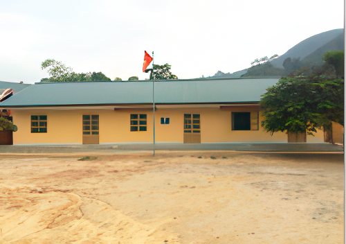 A single-story beige building with a gray roof and multiple windows stands with a flagpole in front. The flag is red and white. There are sparse trees and a hilly background.