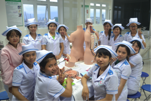 Nursing students studying with modern replica/models provided by ASHA project